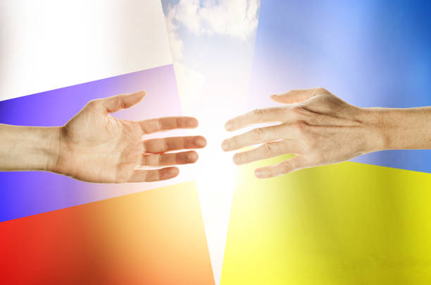 istock Hands people against the backdrop flags Russia and Ukraine 1163604255