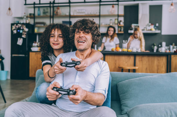 istock Father and son playing video game 1163604498