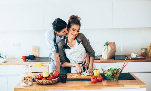 istock Young couple cooking healthy 1163604499