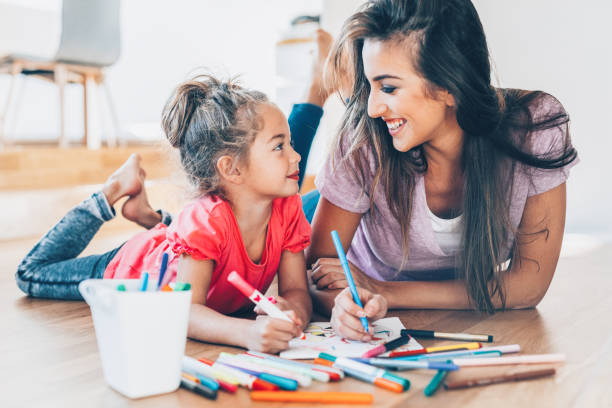 istock Mother and daughter drawing 1163604506