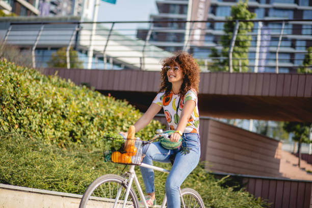 istock a young woman on a bicycle 1163607570