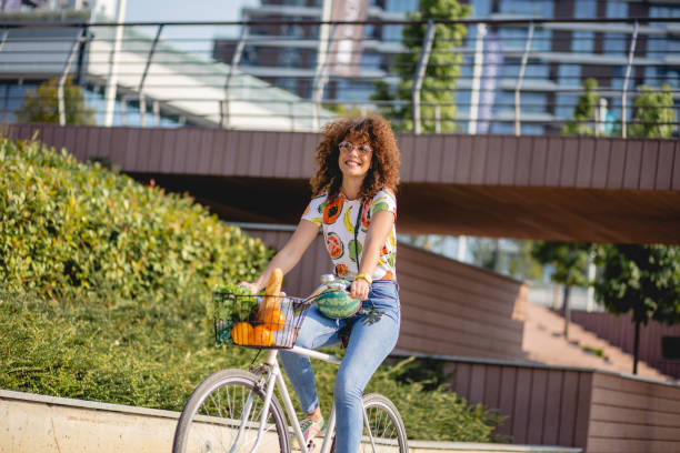 istock a young woman on a bicycle 1163607580
