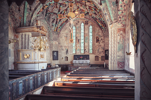 Interior of Härkeberga medieval church, a historical church in the county of Uppland in Sweden. The church has origins from the 14th century, while the frescos by Albertus Pictor was added in the 15th century.