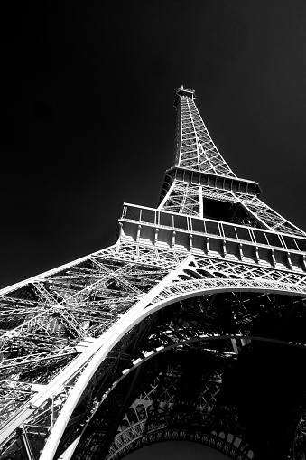 A black and white photo of the Eiffel Tower and part of Paris