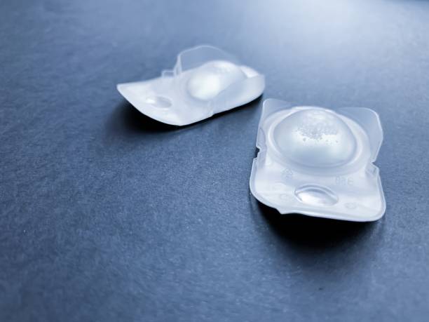 istock Plastics packaging day contact lenses on a dark background.  hygiene.  Vision correction. 1163611499