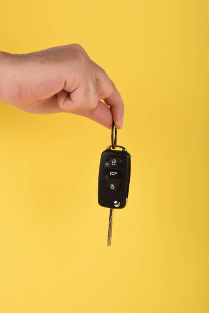 istock Car key, A male hand holding car key 1163615445