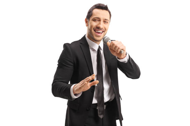 istock Young handsome man with a microphone in his hand 1163617013