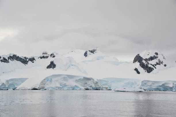 istock Grey clouds cover Antarctica mountains 1163621235
