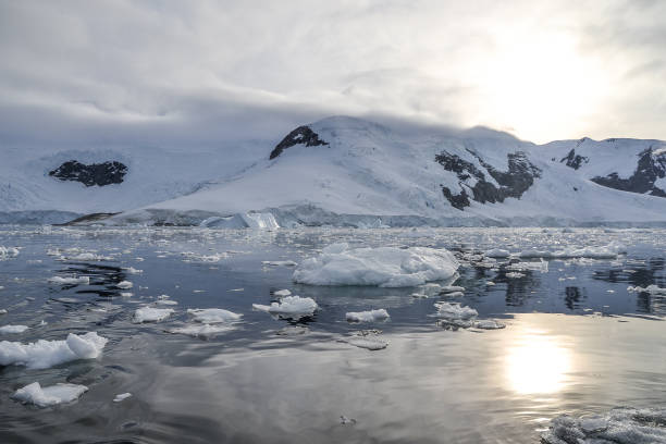 istock Sun setting over the mountains in Antarctica 1163621483