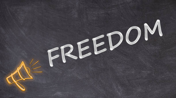 istock Freedom written on blackboard with megaphone 1163621609