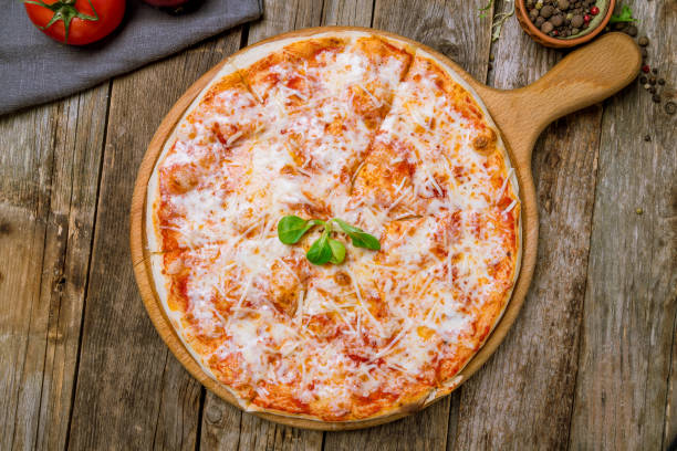 istock Italian pizza Margherita on wooden table 1163621706