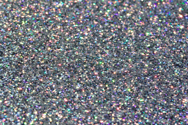 istock Defocused macro abstract background of sparkling silver glitter texture 1163621712
