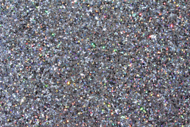istock Defocused macro abstract background of sparkling silver glitter texture 1163623449