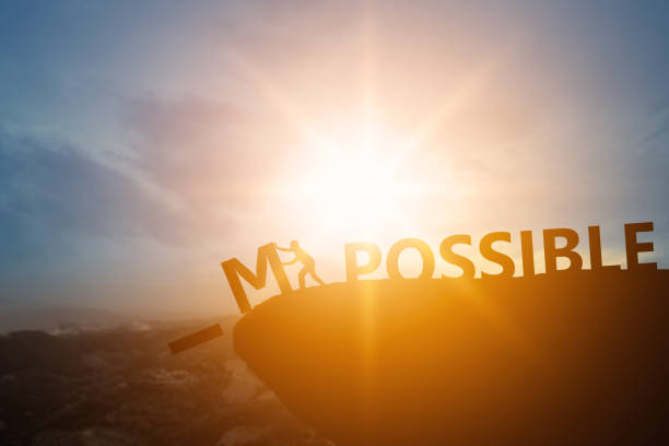 istock Silhouette of people success and chance impossible to possible text on cliff in sunset , can and development concept 1163624286
