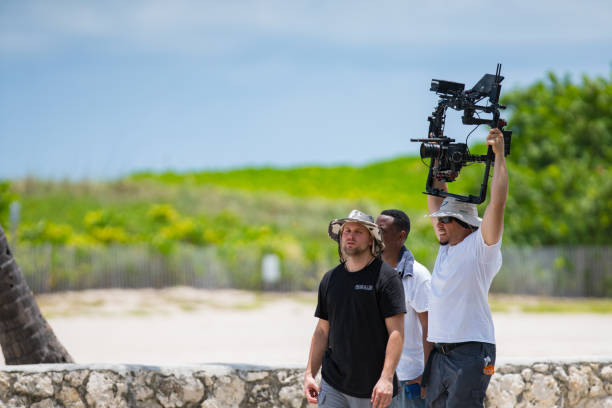 Film crew filming on Ocean Drive Miami Beach Miami Beach, FL, USA - July 20, 2019: Film crew filming on Ocean Drive Miami Beach RED Camera stock pictures, royalty-free photos & images