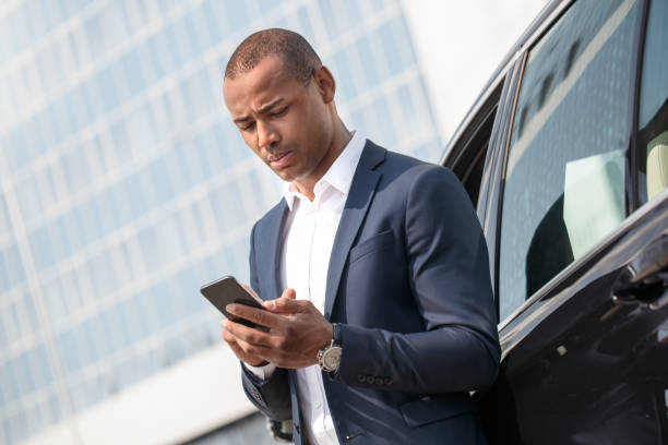 istock Young man standing near car 1163630901