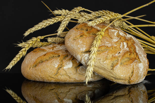 istock Rye wheat bread isolated on black glass 1163632907