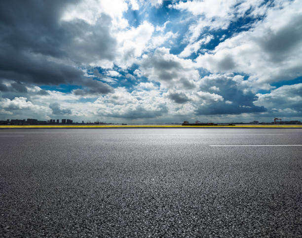 istock Asphalt road and sea coast line 1163637766