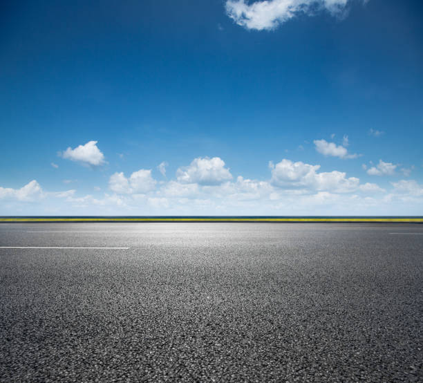 istock Asphalt road and sea coast line 1163637779
