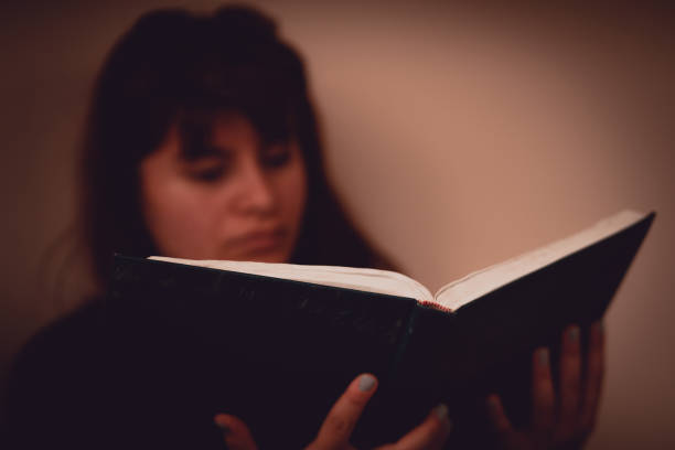 istock Blurred motion of woman reading a book 1163637806