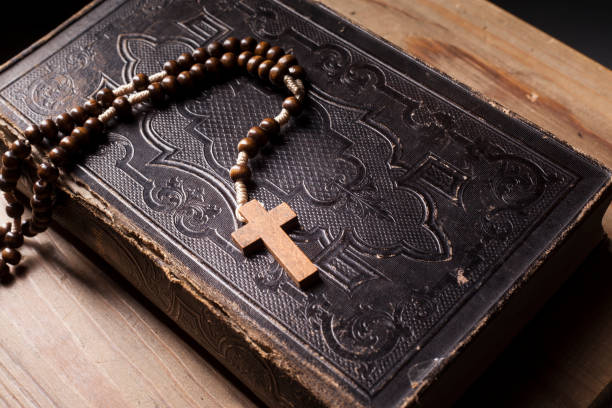 istock Old holy bible with rosary 1163642536