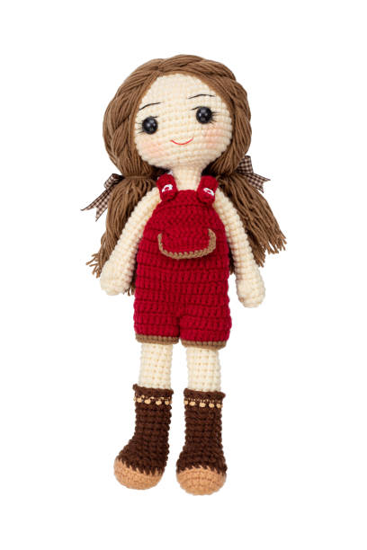 Pretty girl doll crochet by hand make Pretty girl doll crochet by hand make isolated on white background. doll stock pictures, royalty-free photos & images