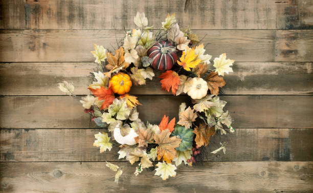 istock Autumn Pumpkin Wreath on an Old Wood Background 1163643971