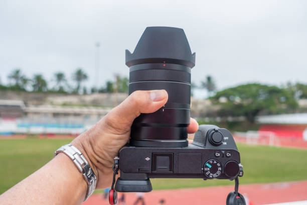 istock Male hand holding a digital camera. 1163643974