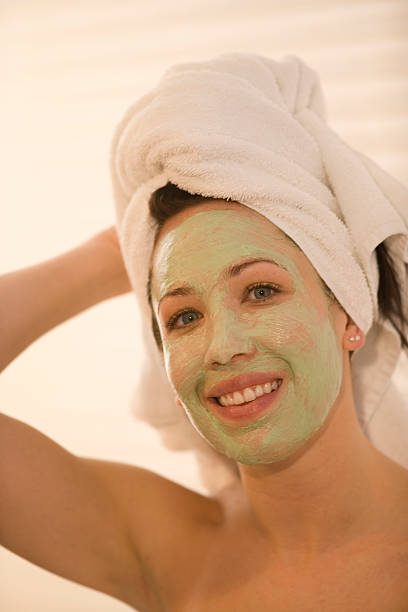 istock Beautiful Female With Facial Mask Applied 116364544