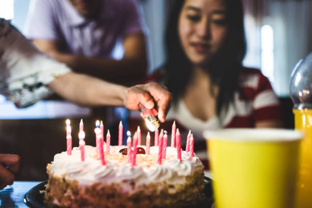 istock Lighting the birthday cake candles 1163645586