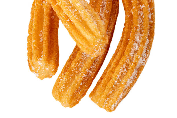 istock Churros isolated on white background. Traditional Mexican  cusine. Churro close up 1163646352