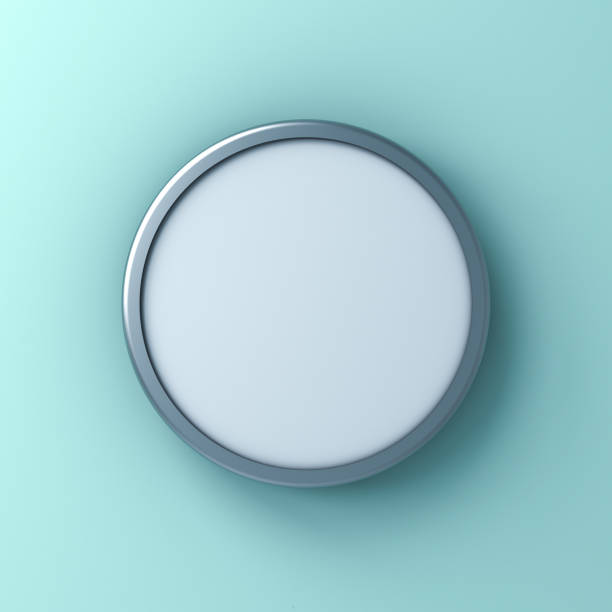 Closeup of silver colored start button on black background