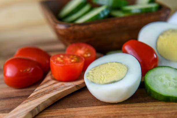 istock Vegetarian breakfast with boiled eggs and fresh vegetables - cucumbers, tomatoes 1163649584