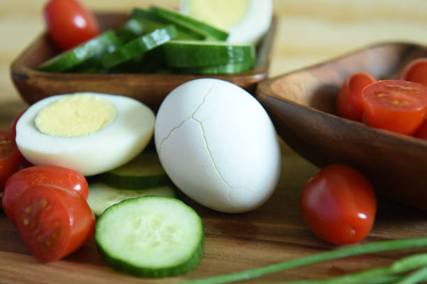istock Vegetarian breakfast with boiled eggs and fresh vegetables - cucumbers, tomatoes 1163649591