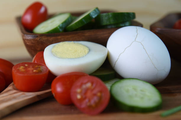 istock Vegetarian breakfast with boiled eggs and fresh vegetables - cucumbers, tomatoes 1163649593
