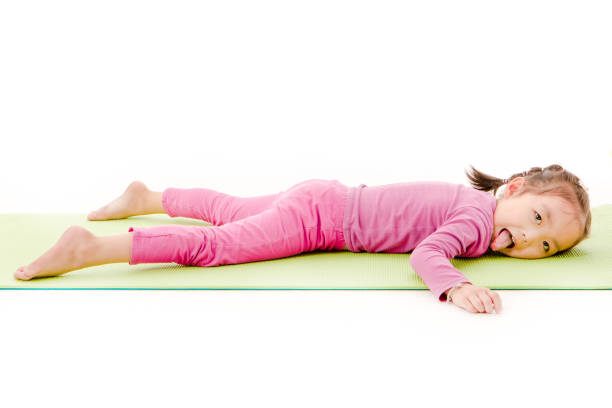 istock little girl practice yoga 1163652229