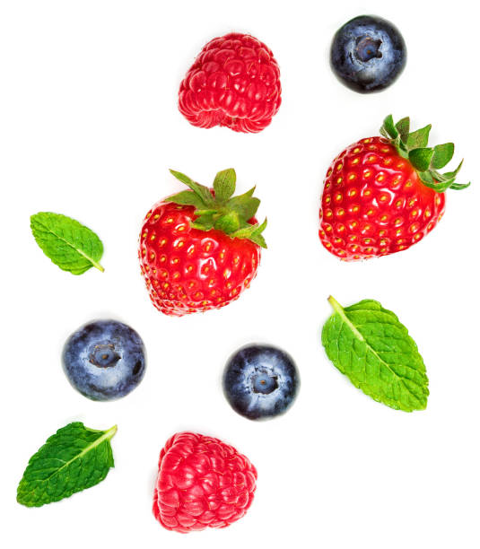 istock Various fresh summer berries  isolated on white background, top view. Strawberry, Raspberry, Blueberry and Mint leaf, flat lay 1163652401
