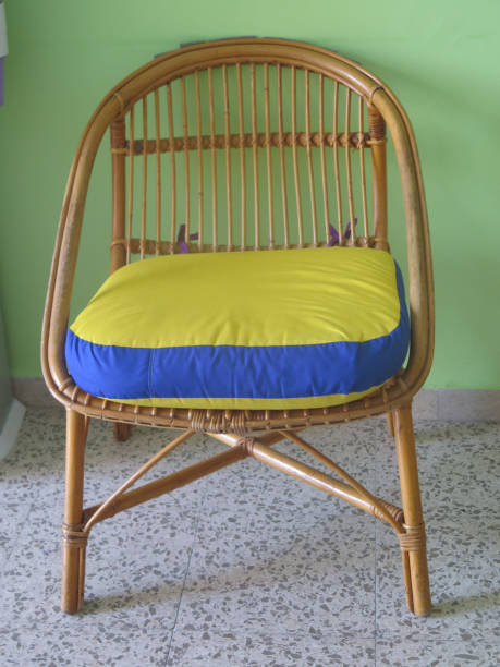 istock Wicker chair with colorfull cushion 1163653103