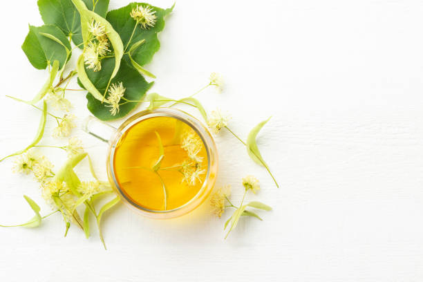 istock Cup of fresh herbal tea with linden blossom 1163660912