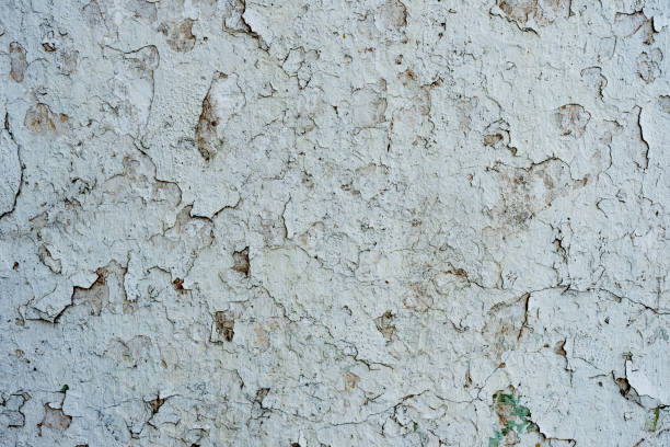 istock Texture of a concrete wall with cracks and scratches which can be used as a background 1163662892