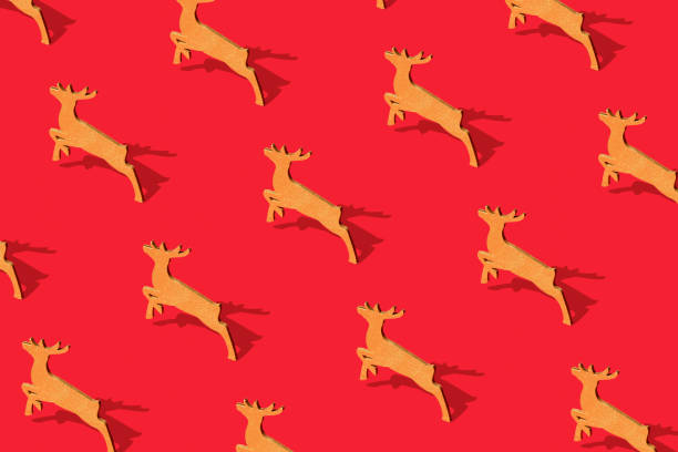 Minimal composition seamless pattern background of gold Christmas Santa's deer on red. New Year concept.