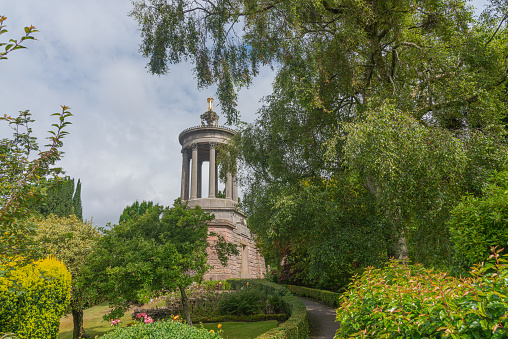 Alloway, Scotland, UK - July 19, 2019:  Burns Memorial in Alloway near Ayr Scotland during the summer months with the gardens being in full bloom. The public have unrestricted right of access in Scotland.