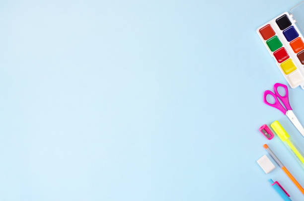 istock Flat lay from a variety of stationery on a blue background. 1163666395
