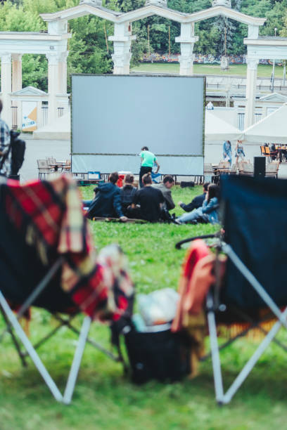 istock two folding chairs with cooling bag with beer and snacks in open air cinema 1163666507