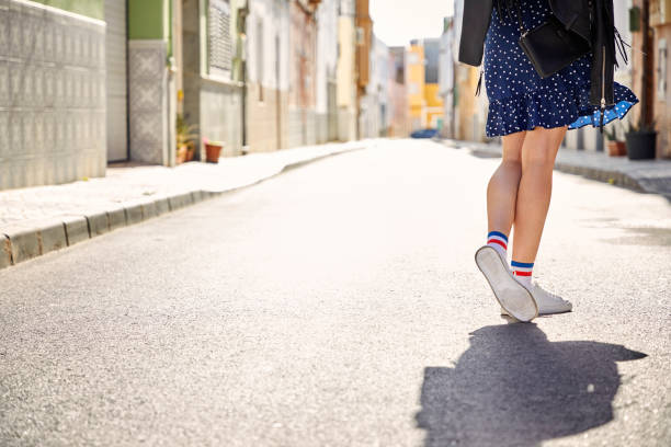 Sunlit sneakers in street