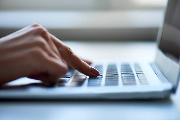 istock Closeup of woman pushing button on keyboard 1163669144