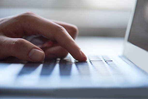istock Man typing on keyboard in closeup 1163669146