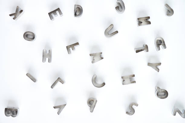 istock Arrangement of letters cutters on white background 1163670356