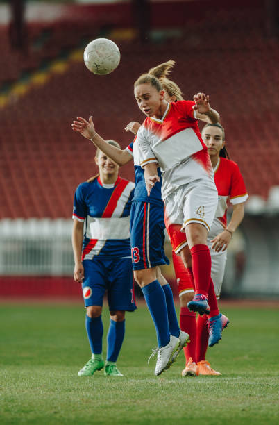 istock Heading the ball on woman's soccer match! 1163671634