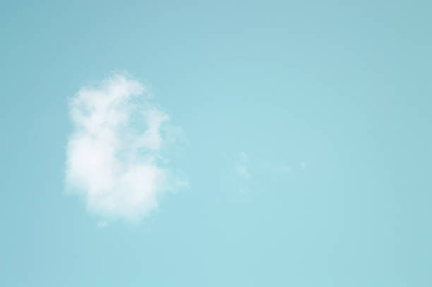 istock Cloud resembling ear isolated on teal blue sky background 1163674116